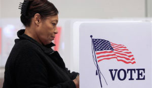 Cassandra Thompson votes at the Cuyahoga County Board of Elections Tuesday, Jan. 31, 2012, in Cleveland. Early voting began Tuesday in Ohio's March 6 presidential primary. Early in-person voting is set to continue until March 2, the Friday before the election. (AP Photo/Tony Dejak)