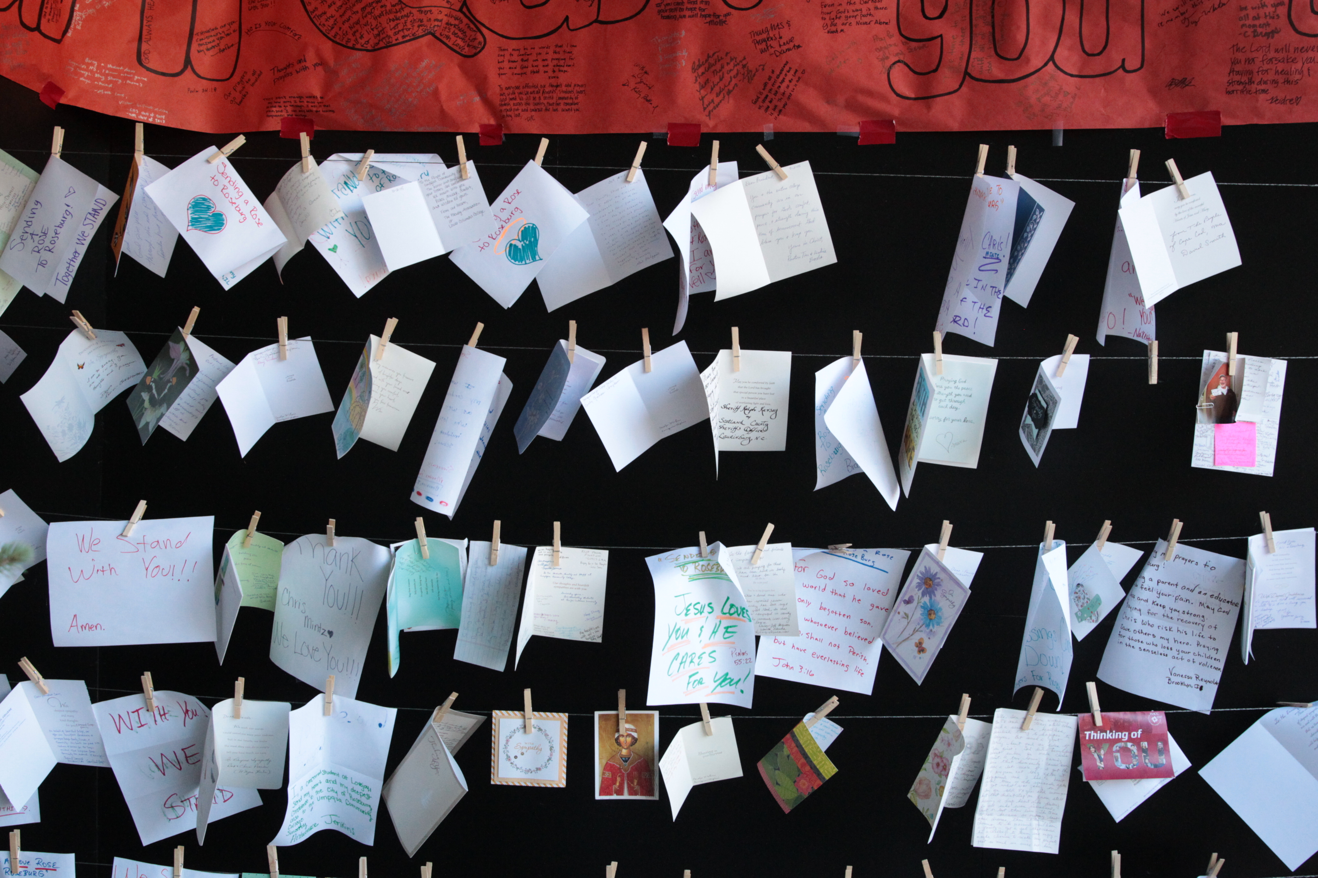 Cards hang at Umpqua Community College, Monday, Oct. 12, 2015, in Roseburg, Oregon. (Beth Nakamura/The Oregonian via AP, Pool)