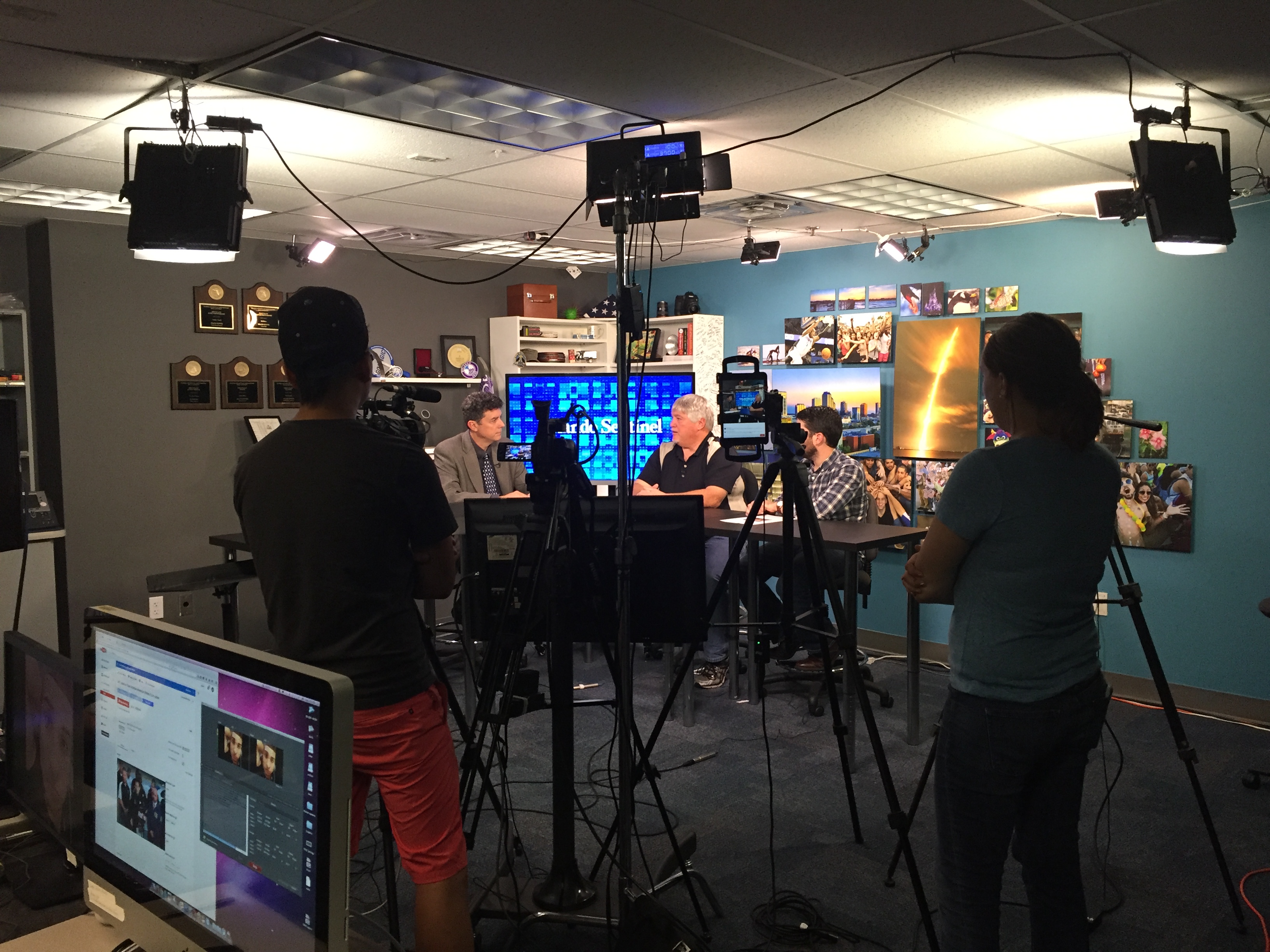 Roger Simmons speaks with reporters during a 7 p.m. Facebook Live broadcast as names of victims were being released. (Photo by Kristen Hare/Poynter)