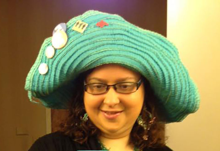 The big blue hat has become part of Michelle Minkoff's conference look. (Photo courtesy Michelle Minkoff)
