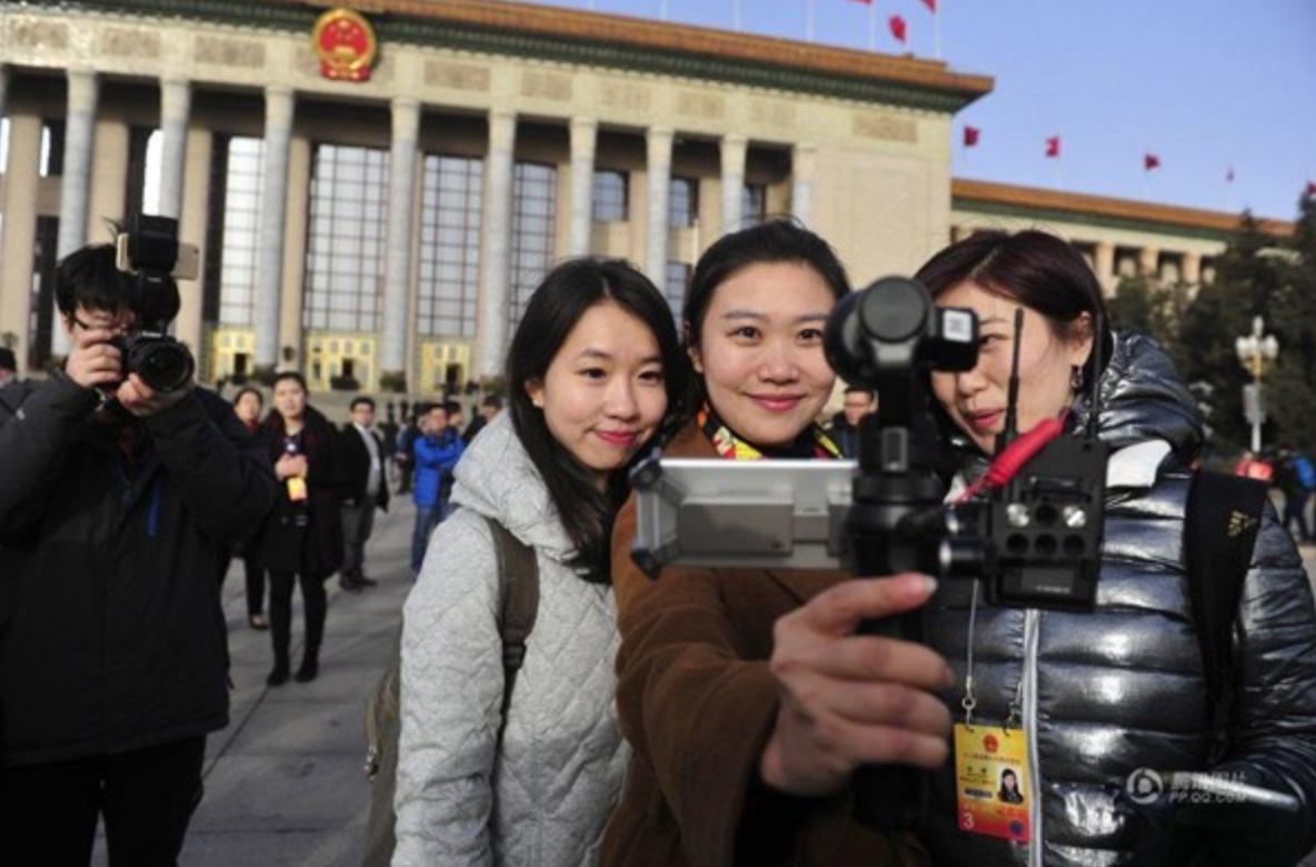 Journalists taking selfies together outside the Great Hall of the People in 2016. Photo part of a series on female journalists taking selfies during the National People’s Congress.