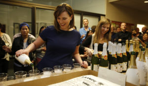 San Francisco Chronicle Editor in Chief Audrey Cooper pours champagne in the newsroom as the newspaper celebrates 150 years of operation on Friday January 16, 2015 in San Francisco, California. (Photo courtesy San Francisco Chronicle)