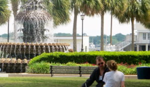 A couple chats near the Pineapple Fountain in the Waterfront Park in Charleston, South Carolina, in 2013. (AP Photo/Bruce Smith)