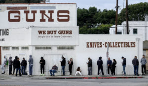 People wait in a line to enter a gun store in Culver City, California, March 15. (AP Photo/Ringo H.W. Chiu)