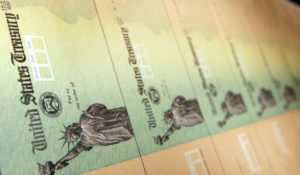 Blank stimulus checks are seen on an idle press at the Philadelphia Regional Financial Center, which disburses payments on behalf of federal agencies, in Philadelphia, Thursday, May 8, 2008. (AP Photo/Matt Rourke)