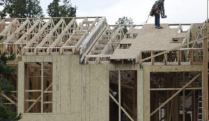 Workers build a multifamiliy dwelling Tuesday, Aug. 4, 2020, in Winter Park, Colorado.  (AP Photo/David Zalubowski)