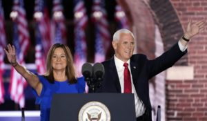 Vice President Mike Pence arrives with his wife Karen Pence to speak on the third day of the Republican National Convention on Wednesday. (AP Photo/Andrew Harnik)