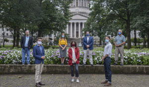 Staff of Mountain State Spotlight gathered for the first time at the capital for socially distanced group photos. Both Ken Ward Jr., and Eric Eyre spoke about the talented, eager reporters they’re now working with, several who are West Virginia natives. (Photo by F. Brian Ferguson)