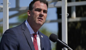 Oklahoma Gov. Kevin Stitt speaks during an Oklahoma Law Enforcement Memorial Ceremony Friday, May 7, 2021, in Oklahoma City. (AP Photo/Sue Ogrocki)