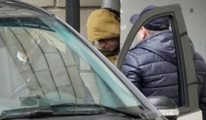 Wall Street Journal reporter Evan Gershkovich is escorted by officers from the Lefortovsky court to a bus in Moscow on Thursday. (AP Photo/Alexander Zemlianichenko)