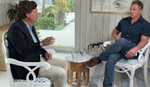 NewsNation anchor Chris Cuomo, right, talking with former Fox News host Tucker Carlson in Florida this week. (Courtesy: NewsNation)