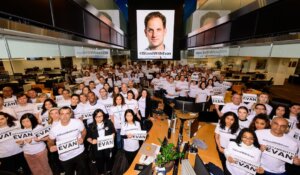 Staff at the Wall Street Journal's New York office hold signs in support of their colleague Evan Gershkovich, who was detained by Russia a year ago while on a reporting assignment. (Courtesy: Wall Street Journal) 
Credit: Cam Pollack/The Wall Street Journal