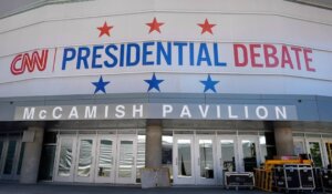 Signage outside the media file center for the upcoming presidential debate is seen near the CNN Techwood campus in Atlanta on Tuesday. (AP Photo/Pablo Martinez Monsivais)