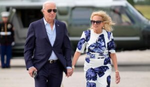 President Joe Biden, left, and first lady Jill Biden arrive on Marine One at East Hampton Airport in East Hampton, N.Y.  on Saturday. (AP Photo/Evan Vucci)