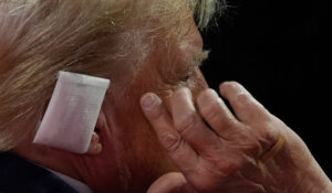 Former President Donald Trump, with a bandage on his ear, at the Republican National Convention on Tuesday. (AP Photo/Julia Nikhinson)