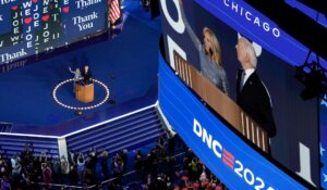 President Joe Biden and First Lady Jill Biden wave during the Democratic National Convention on Monday. (AP Photo/Morry Gash)