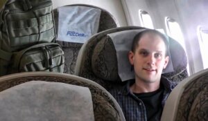 In this image made from a video provided by the Russian Federal Security Service via RTR on Thursday, Wall Street Journal reporter Evan Gershkovich sits inside an airplane at an airport outside Moscow, Russia. (Russian Federal Security Service/RTR via AP)