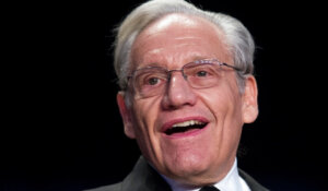 In this April 29, 2017, file photo journalist Bob Woodward sits at the head table during the White House Correspondents' Dinner in Washington. (AP Photo/Cliff Owen, File)