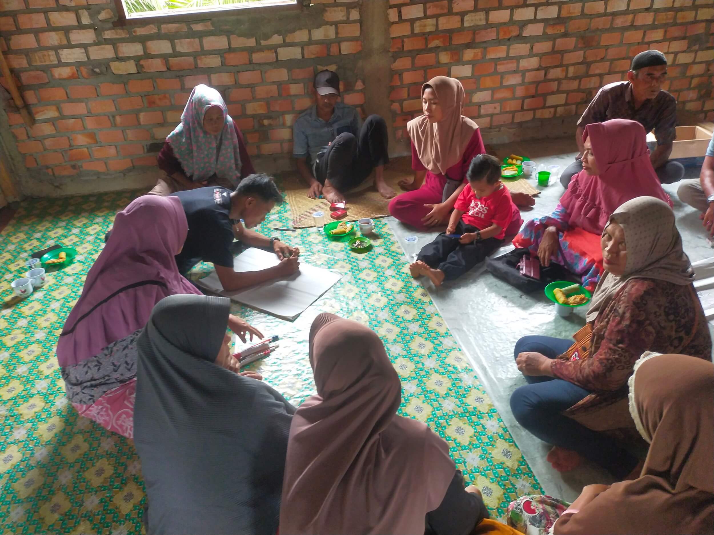 Group of people sitting together and working in a small group.