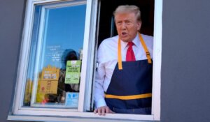 Donald Trump speaks from a drive-thru window during a campaign stop at a McDonald's last Sunday in Feasterville-Trevose, Pa. (AP Photo/Evan Vucci)