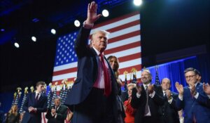 Donald Trump waves to the crowd at an election night watch party at the Palm Beach Convention Center in the early hours of Wednesday morning, in West Palm Beach, Fla. (AP Photo/Evan Vucci)