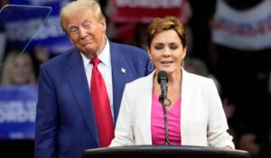 President-elect Donald Trump with Kari Lake at a campaign event in October. (AP Photo/Ross Franklin)