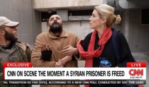 CNN’s Clarissa Ward, right, escorts a man, center, who was supposedly freed from a Syrian prison last week. (Courtesy: CNN)